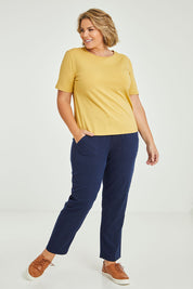 Model Fiona wearing size 16 of The Keepers Tee in colour Camel, from the front, showing the whole outfit
