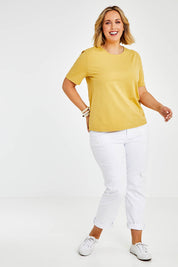 Model Jess wearing size 14 of The Keepers Tee in colour Camel, from the front, showing the whole outfit