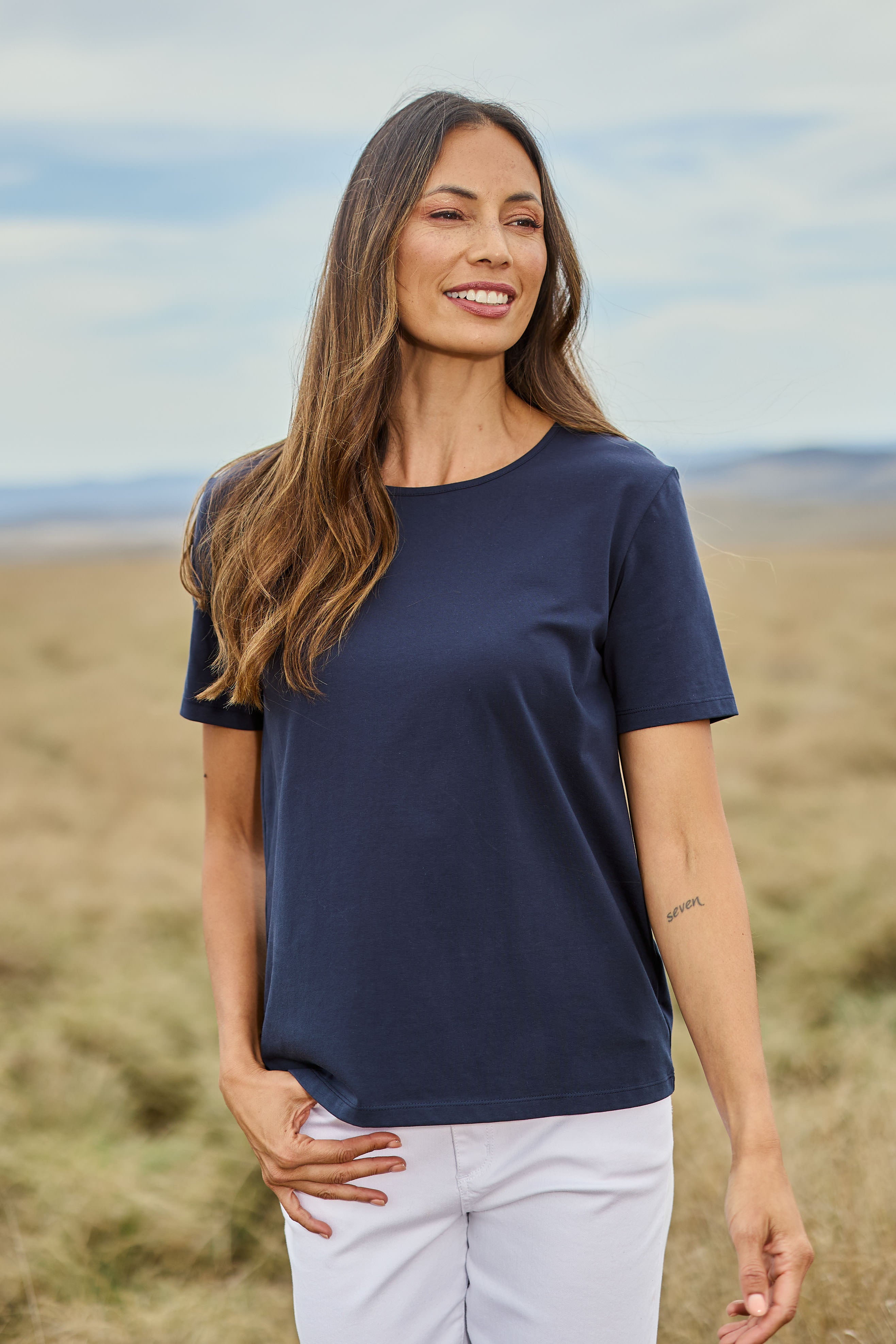 Model Amanda wearing size 10 of The Keepers Tee in colour Darknavy (Blue), from the front, showing the whole outfit