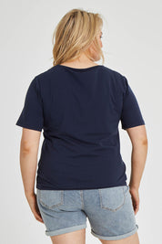 Model Keeara wearing The Keepers Tee in colour Darknavy (Blue), from the back