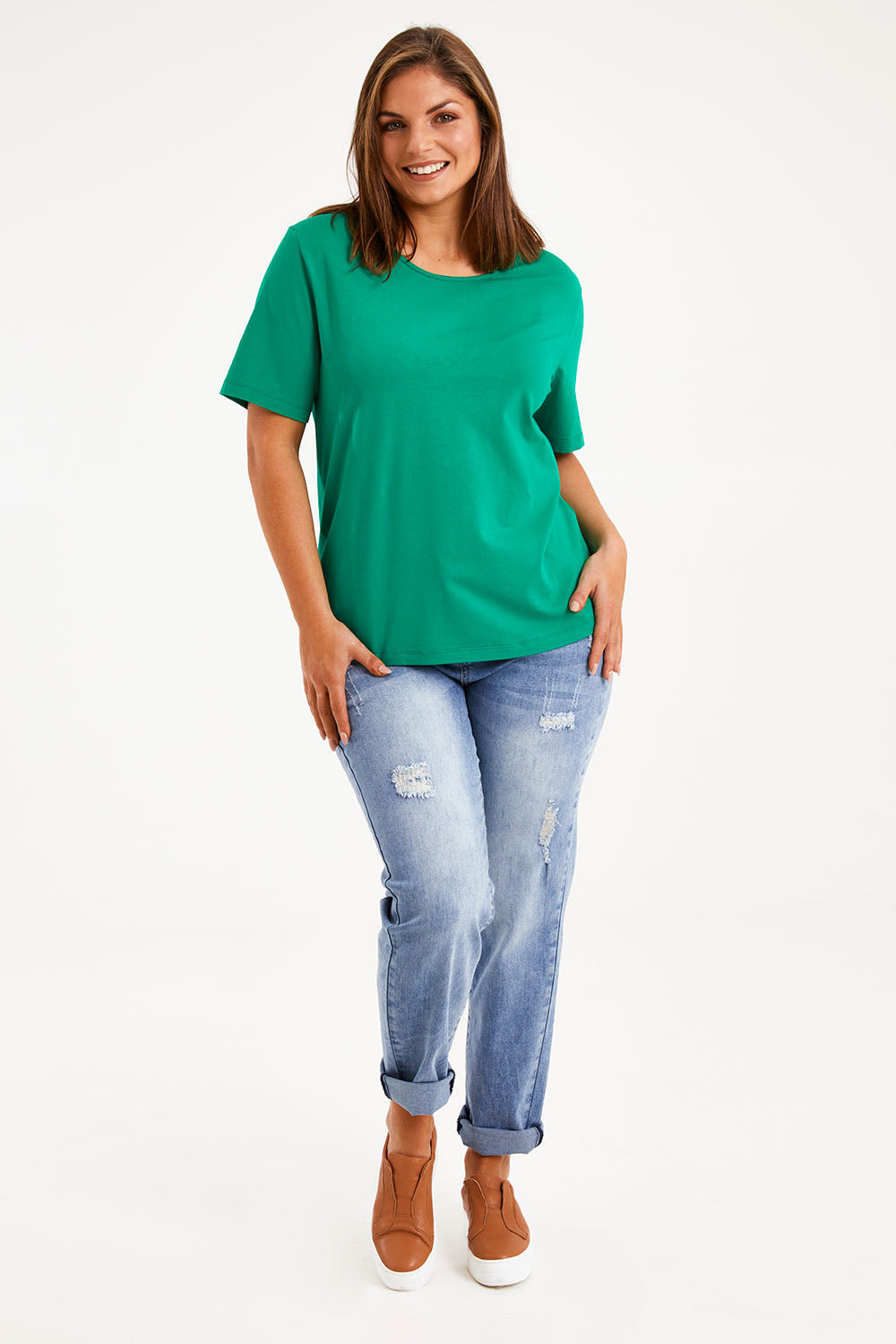 Model Monique wearing size 14 of The Keepers Tee in colour Emerald (Green), from the front, showing the whole outfit