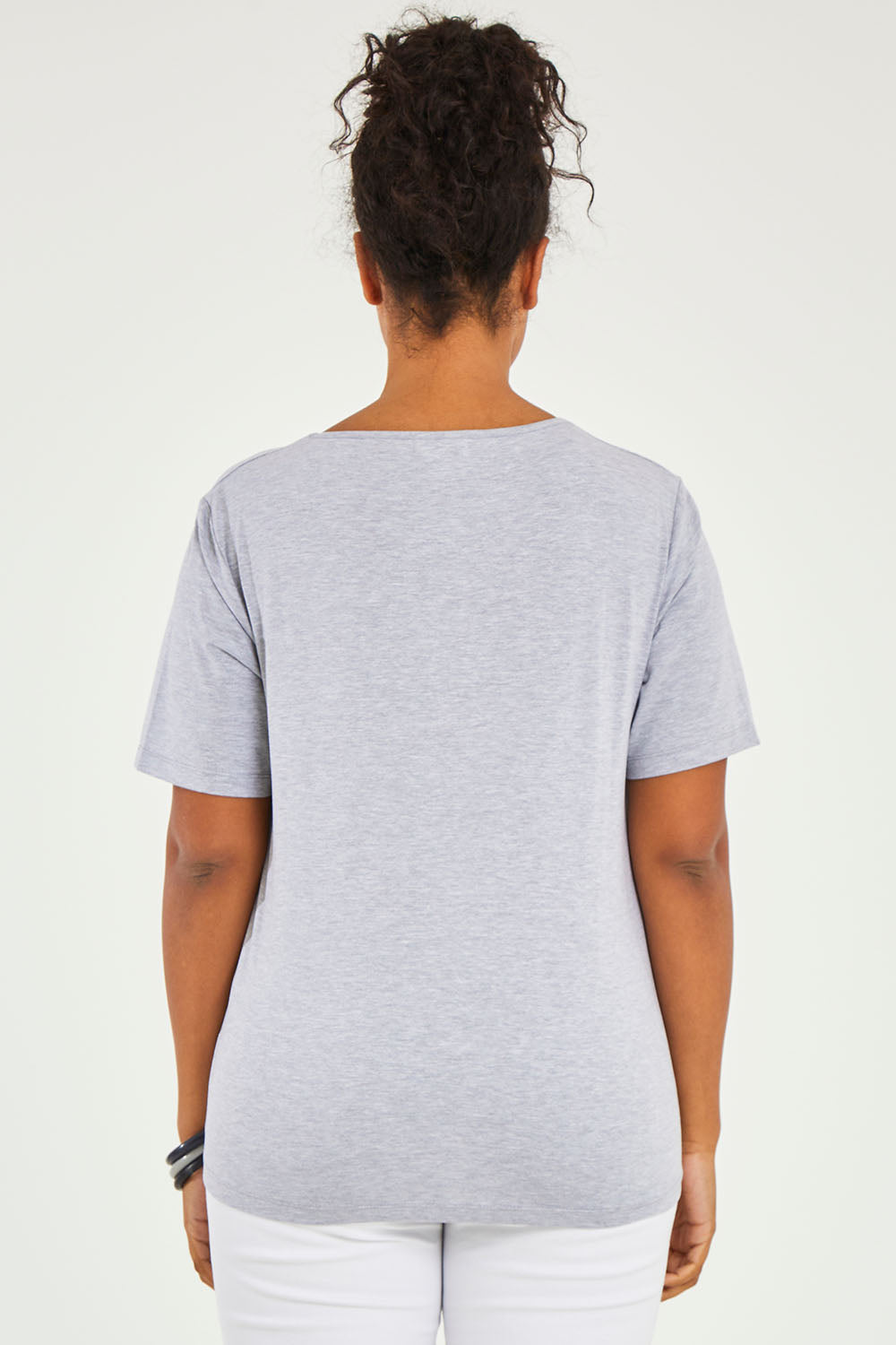 Model Noli wearing size 14 of The Keepers Tee in colour Greymarle (Grey), from the back