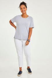 Model Noli wearing size 14 of The Keepers Tee in colour Greymarle (Grey), from the front, showing the whole outfit