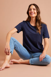 Model Madeline wearing size 10 of The Keepers Tee in colour Navy (Blue), from the front, showing the whole outfit