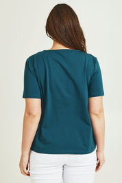 Model Janed wearing size 14 of the The Keepers Cotton Tee – Opal in colour Opal, from the back