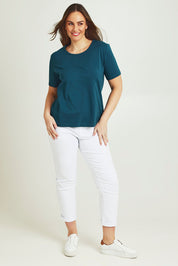 Model Janed wearing size 14 of the The Keepers Cotton Tee – Opal in colour Opal, from the front
