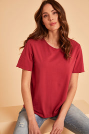 Model Madeline wearing size 10 of The Keepers Tee in colour Rose (Pink), from the front, showing the whole outfit