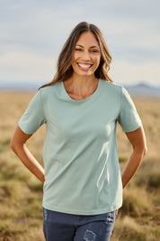 Model Amanda wearing size 10 of The Keepers Tee in colour Sage (Green), from the front, showing the whole outfit