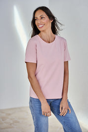 Model Amanda wearing size 10 of The Keepers Tee in colour Softpink (Pink), from the front, showing the whole outfit