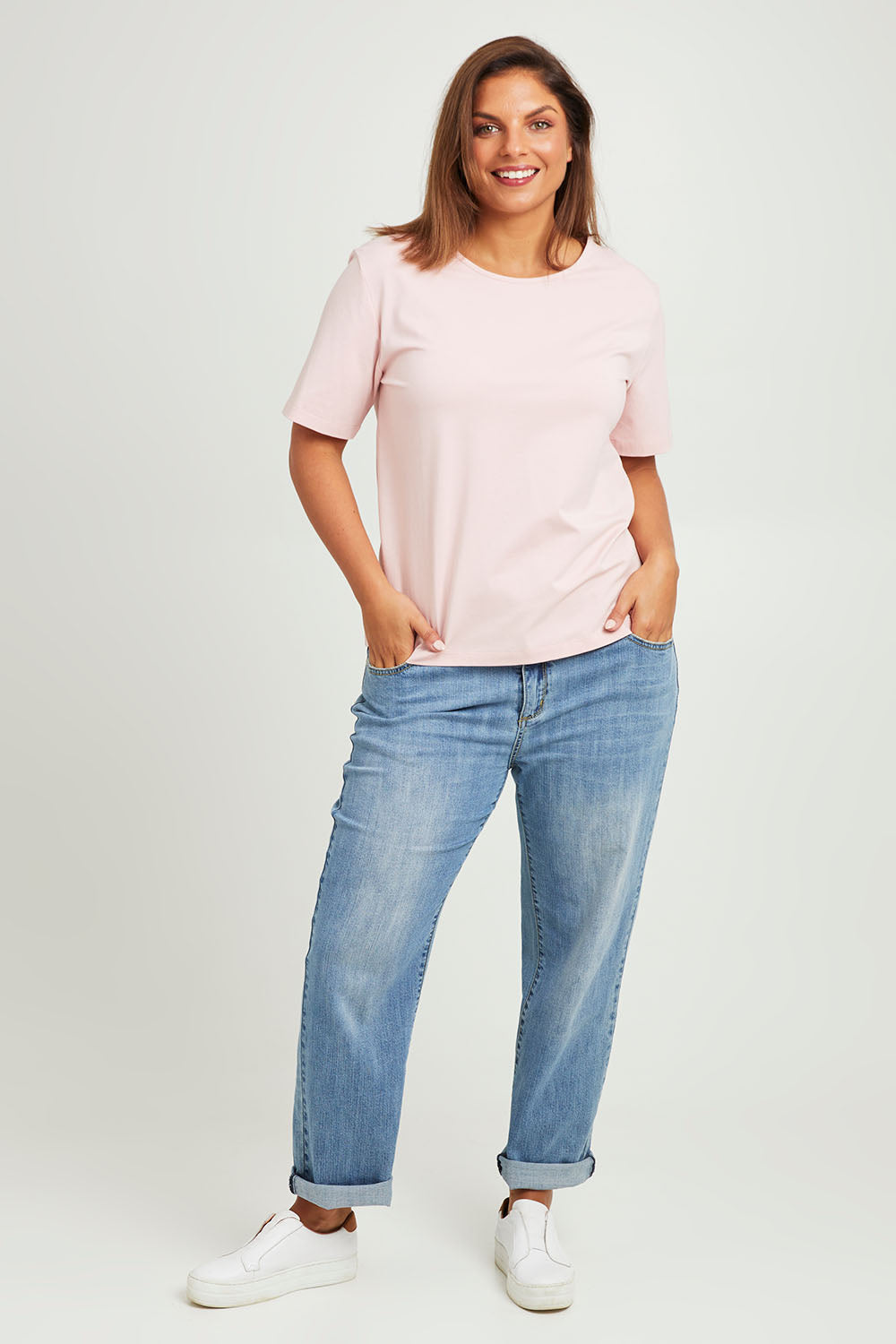 Model Monique wearing size 14 of The Keepers Tee in colour Softpink (Pink), from the front, showing the whole outfit