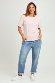 Model Monique wearing size 14 of The Keepers Tee in colour Softpink (Pink), from the front, showing the whole outfit