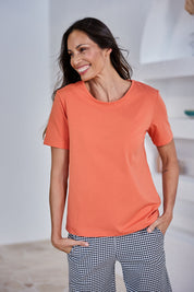 Model Amanda wearing size 10 of The Keepers Tee in colour Sunset, from the front, showing the whole outfit