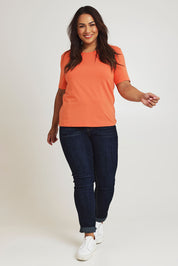 Model Ashleigh wearing size 16 of The Keepers Tee in colour Sunset, from the front, showing the whole outfit
