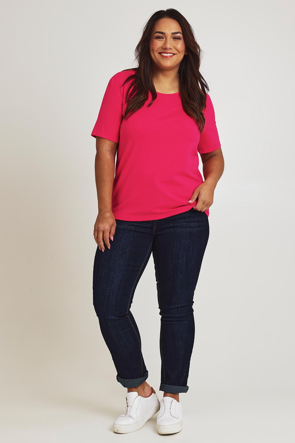 Model Ashleigh wearing size 16 of The Keepers Tee in colour Watermelon (Pink), from the front, showing the whole outfit