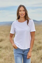 Model Amanda wearing size 10 of The Keepers Tee in colour White (White), from the front, showing the whole outfit