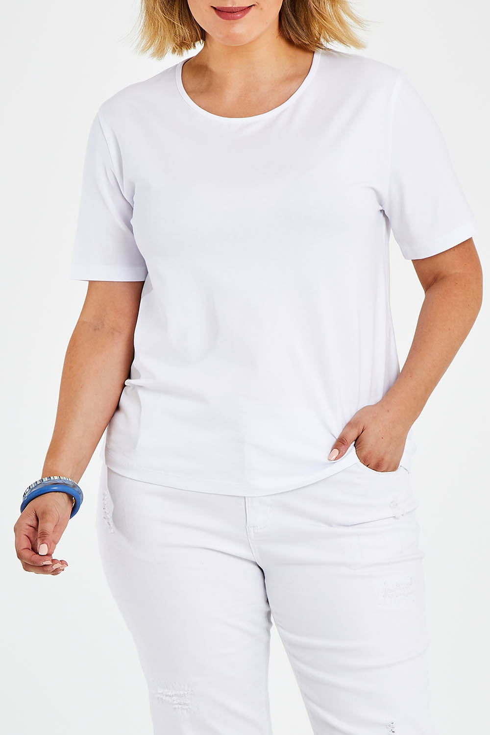 Model Jess wearing size 14 of The Keepers Tee in colour White (White), from the front, cropped image