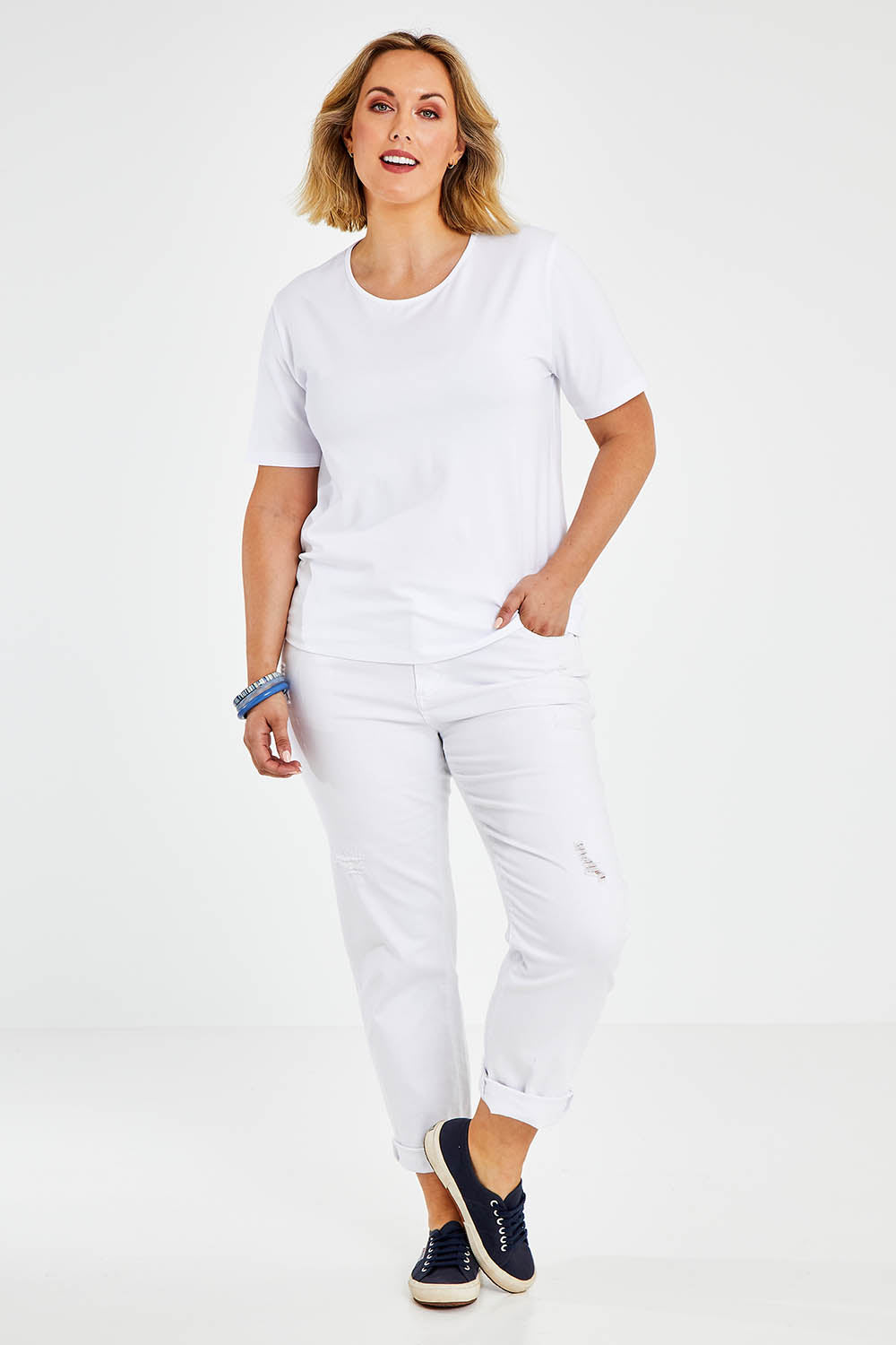 Model Jess wearing size 14 of The Keepers Tee in colour White (White), from the front, showing the whole outfit