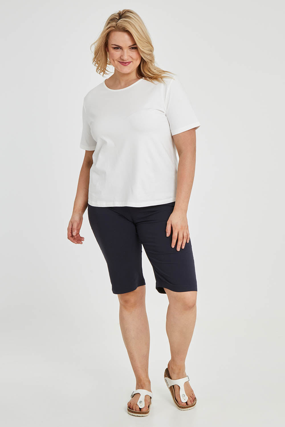 Model Keeara wearing size 16 of The Keepers Tee in colour White (White), from the front, showing the whole outfit
