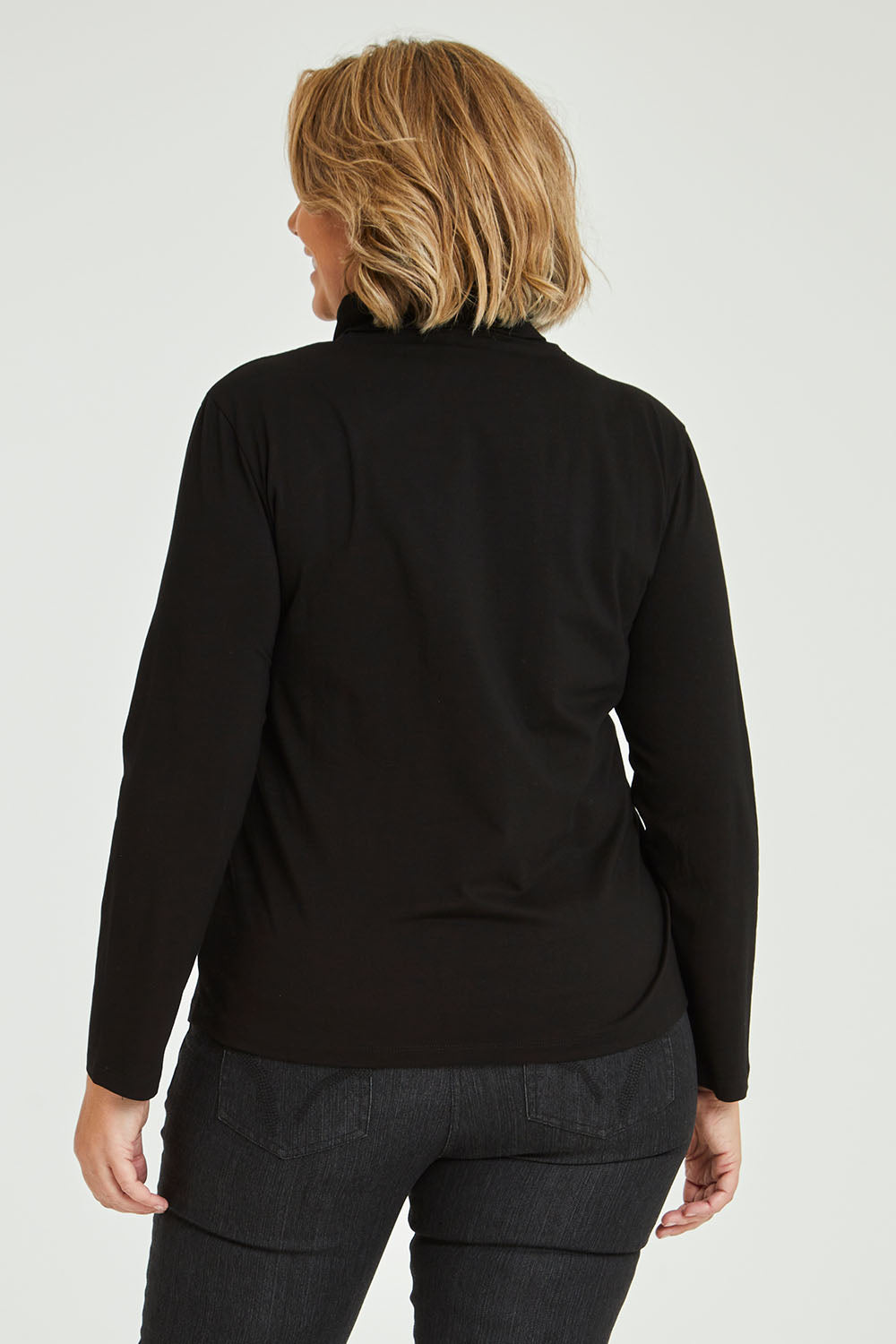 Model Fiona wearing size 16 of The Keepers Skivvy in colour Black (Black), from the back