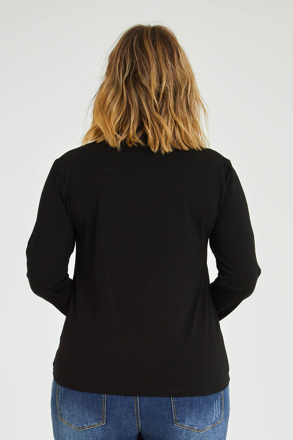 Model Jess wearing size 14 of The Keepers Skivvy in colour Black (Black), from the back