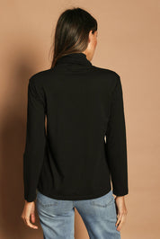 Model Madeline wearing size 10 of The Keepers Skivvy in colour Black (Black), from the back