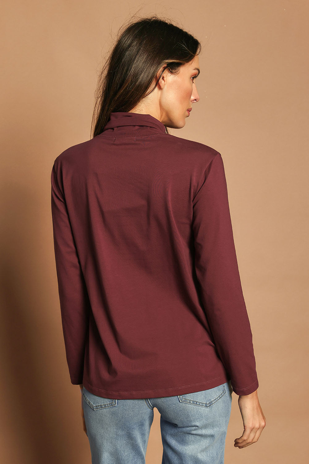 Model Madeline wearing size 10 of The Keepers Skivvy in colour Burgundy (Purple), from the back