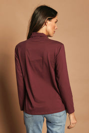 Model Madeline wearing size 10 of The Keepers Skivvy in colour Burgundy (Purple), from the back