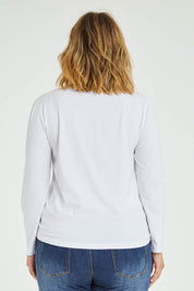 Model Jess wearing size 14 of The Keepers Skivvy in colour White (White), from the front, cropped image