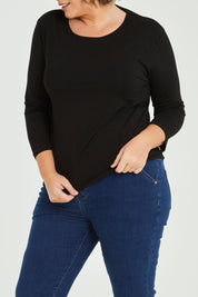 Model Fiona wearing size 16 of The Keepers 3/4 Sleeve Tee in colour Black (Black), from the front, cropped image