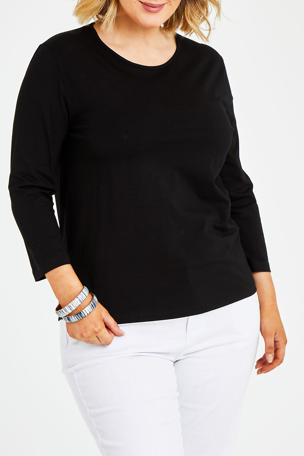 Model Jess wearing size 14 of The Keepers 3/4 Sleeve Tee in colour Black (Black), from the front, cropped image