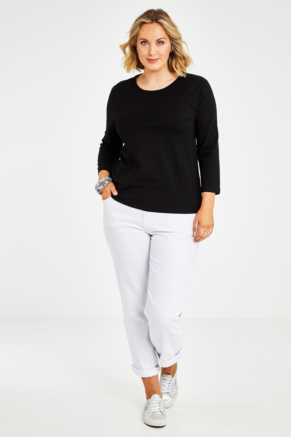 Model Jess wearing size 14 of The Keepers 3/4 Sleeve Tee in colour Black (Black), from the front, showing the whole outfit