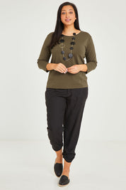 Model Terri-Leigh wearing size 14 of The Keepers 3/4 Sleeve Tee in colour Khaki (Green), from the front, showing the whole outfit