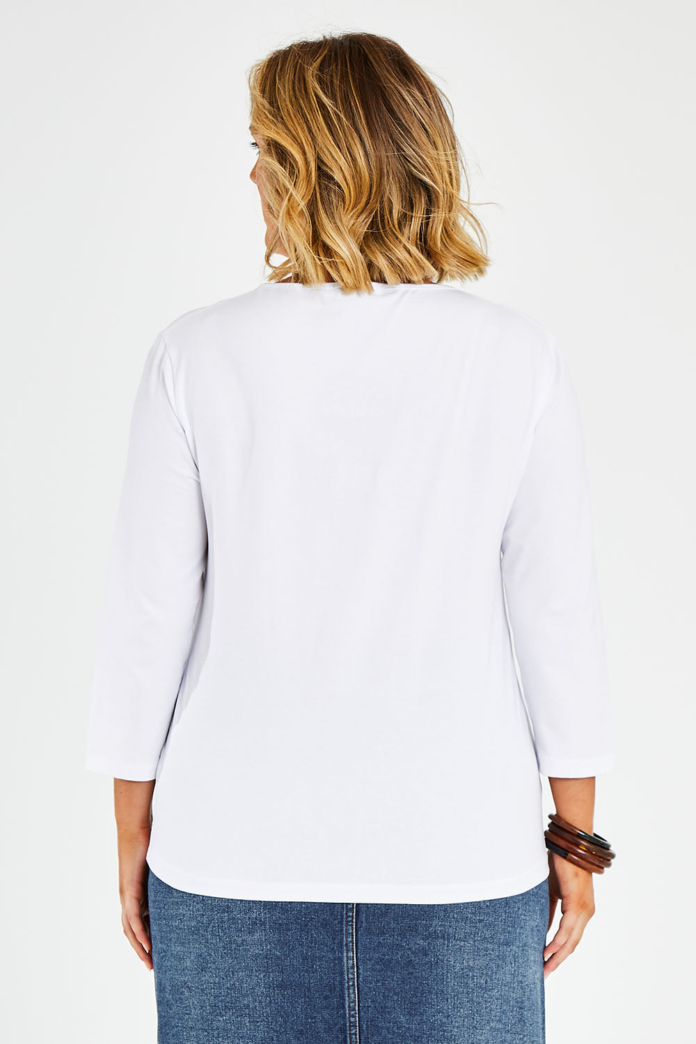 Model Jess wearing size 14 of The Keepers 3/4 Sleeve Tee in colour White (White), from the back
