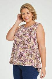 Model Fiona wearing size 16 of The Woven Swing Tank in colour Multispot (White), from the front, cropped image