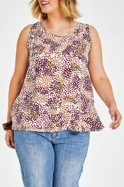 Model Jess wearing size 14 of The Woven Swing Tank in colour Multispot (White), from the front, cropped image