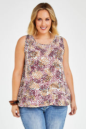 Model Jess wearing The Woven Swing Tank in colour Multispot (White), from the front, cropped image
