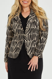 Model Katie wearing size 16 of The Everyday Printed Long Sleeve Blazer in colour Blackcamel (Black), from the front, cropped image