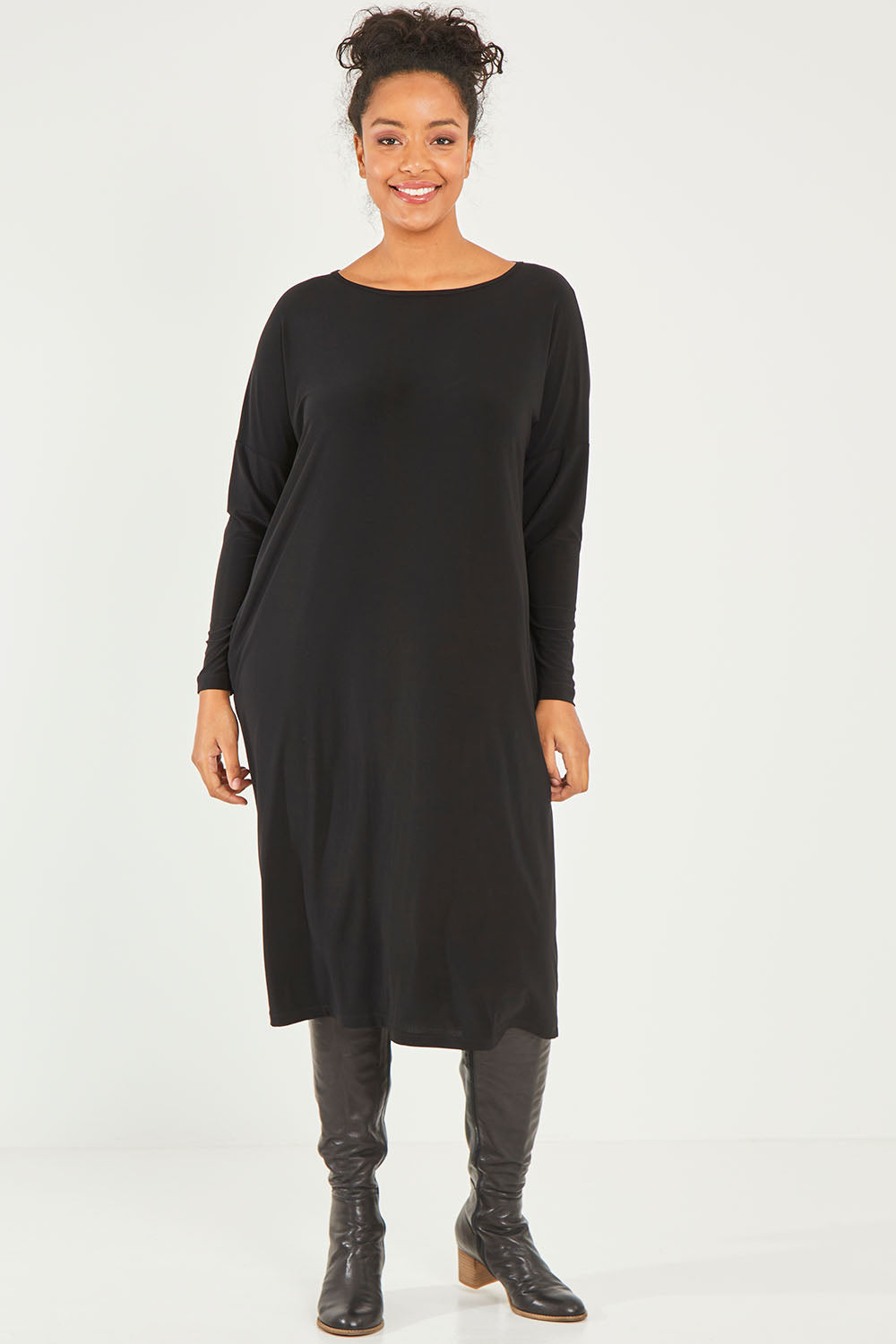 Model Noli wearing size 14 of The Recycled Long Sleeve Everyday Dress in colour Black (Black), from the front, showing the whole outfit
