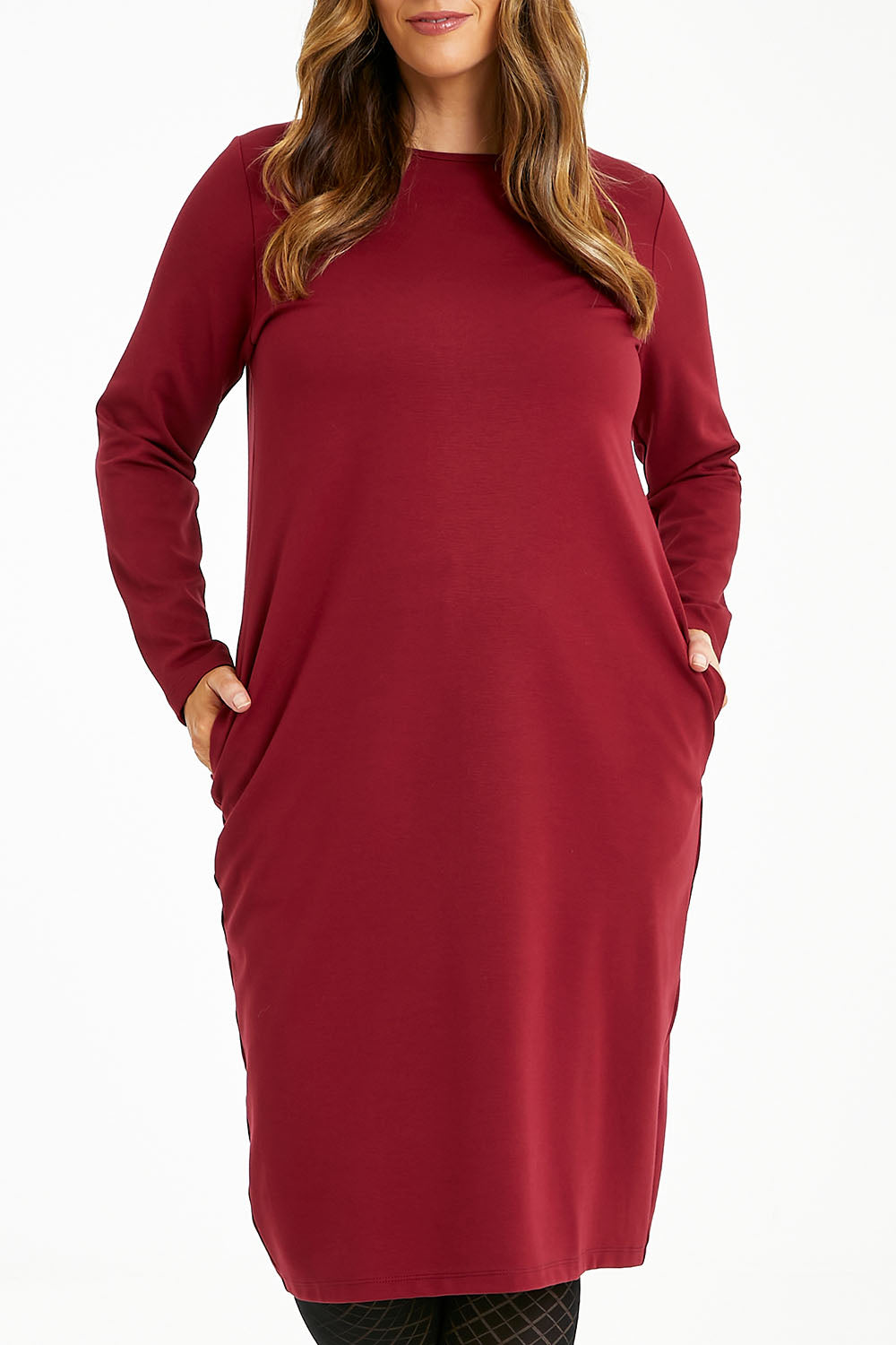 Model Laura wearing size 14 of The Dropped Shoulder Ponte Dress in colour Pomegranat (Red), from the front, cropped image