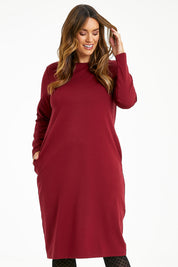 Model Laura wearing size 14 of The Dropped Shoulder Ponte Dress in colour Pomegranat (Red), from the front, cropped image