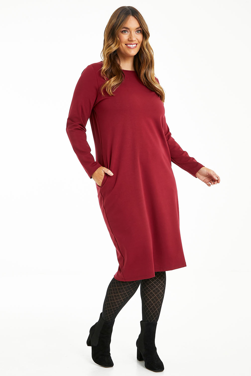Model Laura wearing size 14 of The Dropped Shoulder Ponte Dress in colour Pomegranat (Red), from the front, showing the whole outfit