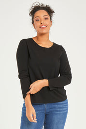 Model Noli wearing size 14 of The Keepers Long Sleeve Tee in colour Black (Black), from the front, cropped image
