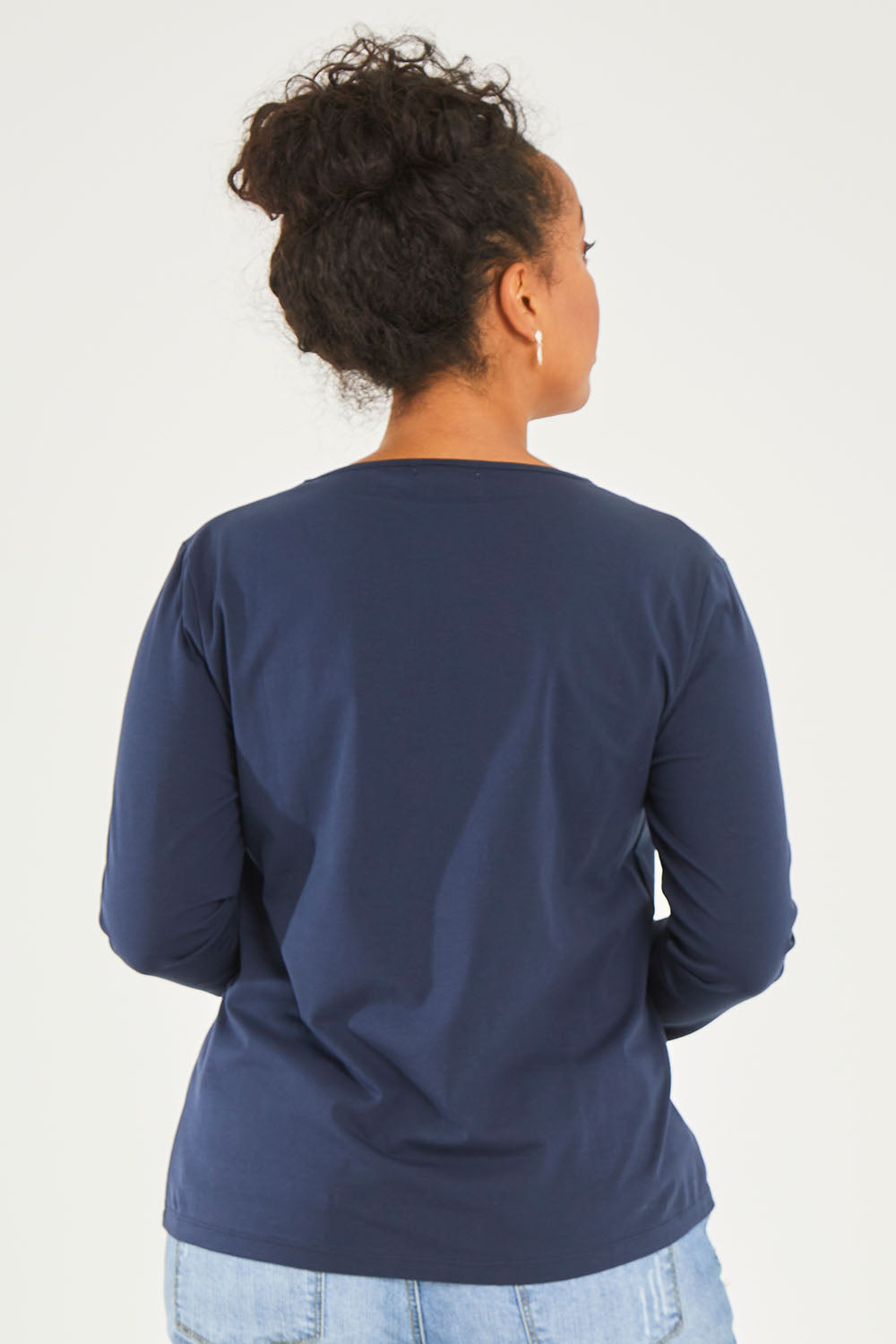 Model Noli wearing size 14 of The Keepers Long Sleeve Tee in colour Darknavy (Blue), from the back