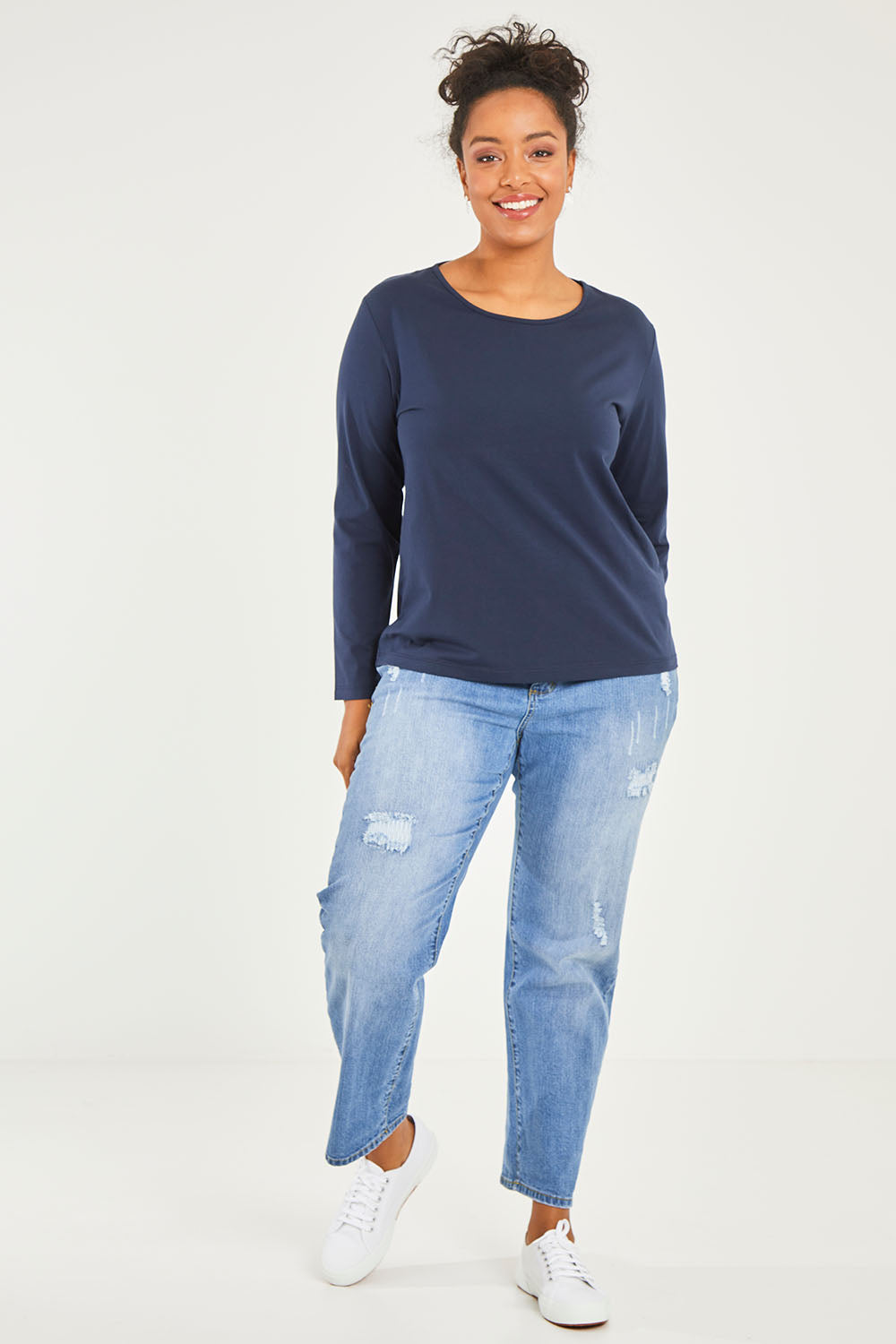 Model Noli wearing size 14 of The Keepers Long Sleeve Tee in colour Darknavy (Blue), from the front, showing the whole outfit