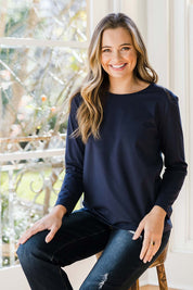 Model Tahlia wearing size 10 of The Keepers Long Sleeve Tee in colour Darknavy (Blue), from the front, showing the whole outfit