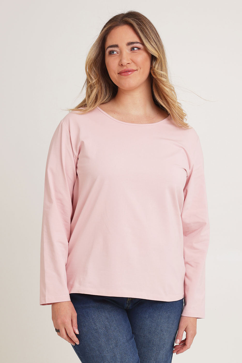 Model Chanel wearing size 16 of The Keepers Long Sleeve Tee in colour Softpink (Pink), from the front, cropped image