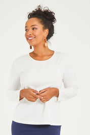 Model Noli wearing size 14 of The Keepers Long Sleeve Tee in colour White (White), from the front, cropped image