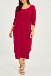 Model Terri-Leigh wearing size 14 of The Recycled Rouched 3/4 Sleeve Dress in colour Cherryred (Red), from the front, cropped image
