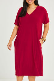 Model Terri-Leigh wearing size 14 of The Recycled Everyday V Neck Dress in colour Cherryred (Red), from the front, cropped image