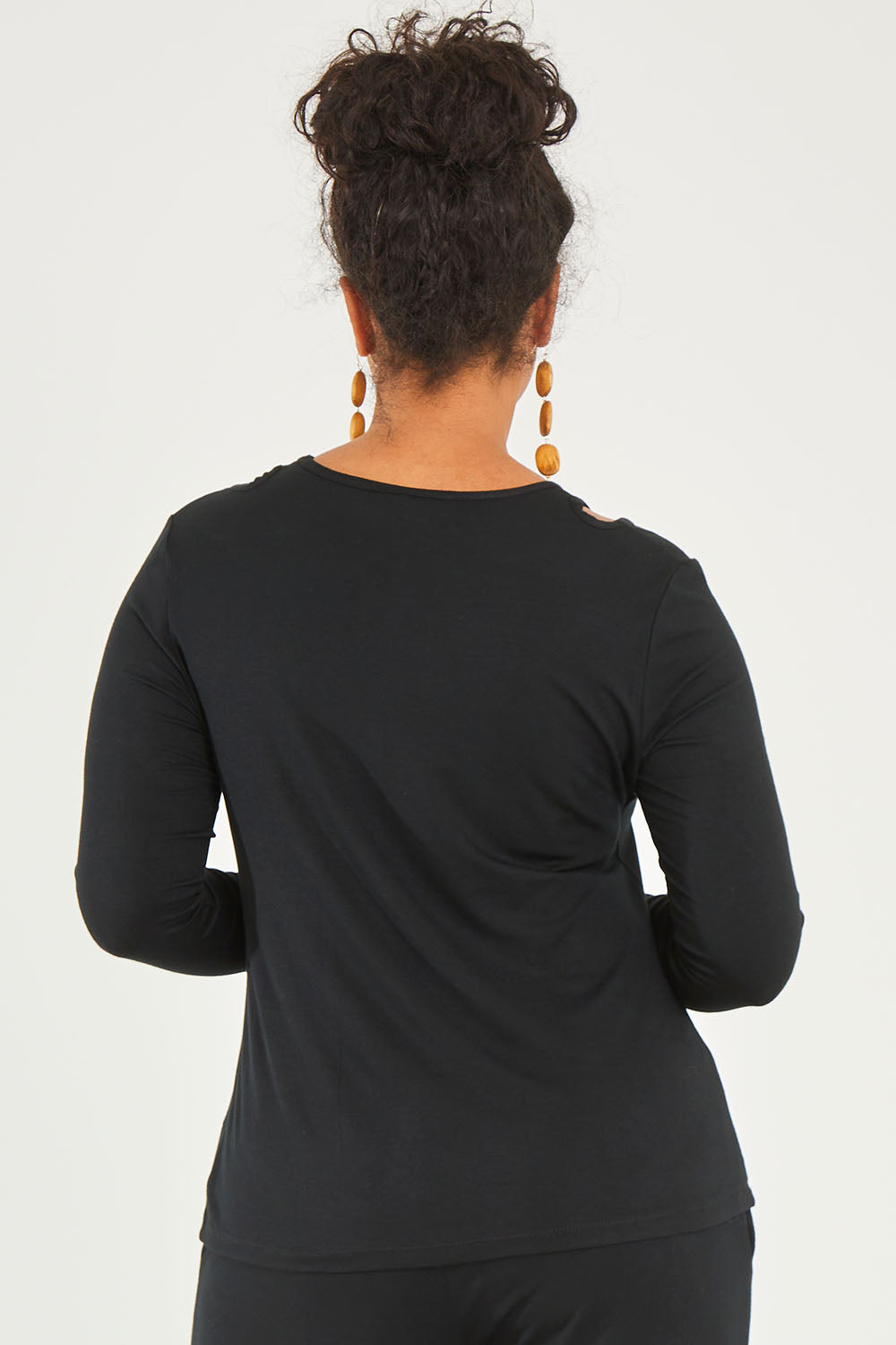 Model Noli wearing size 14 of The Cut Out Jersey Top in colour Black (Black), from the back